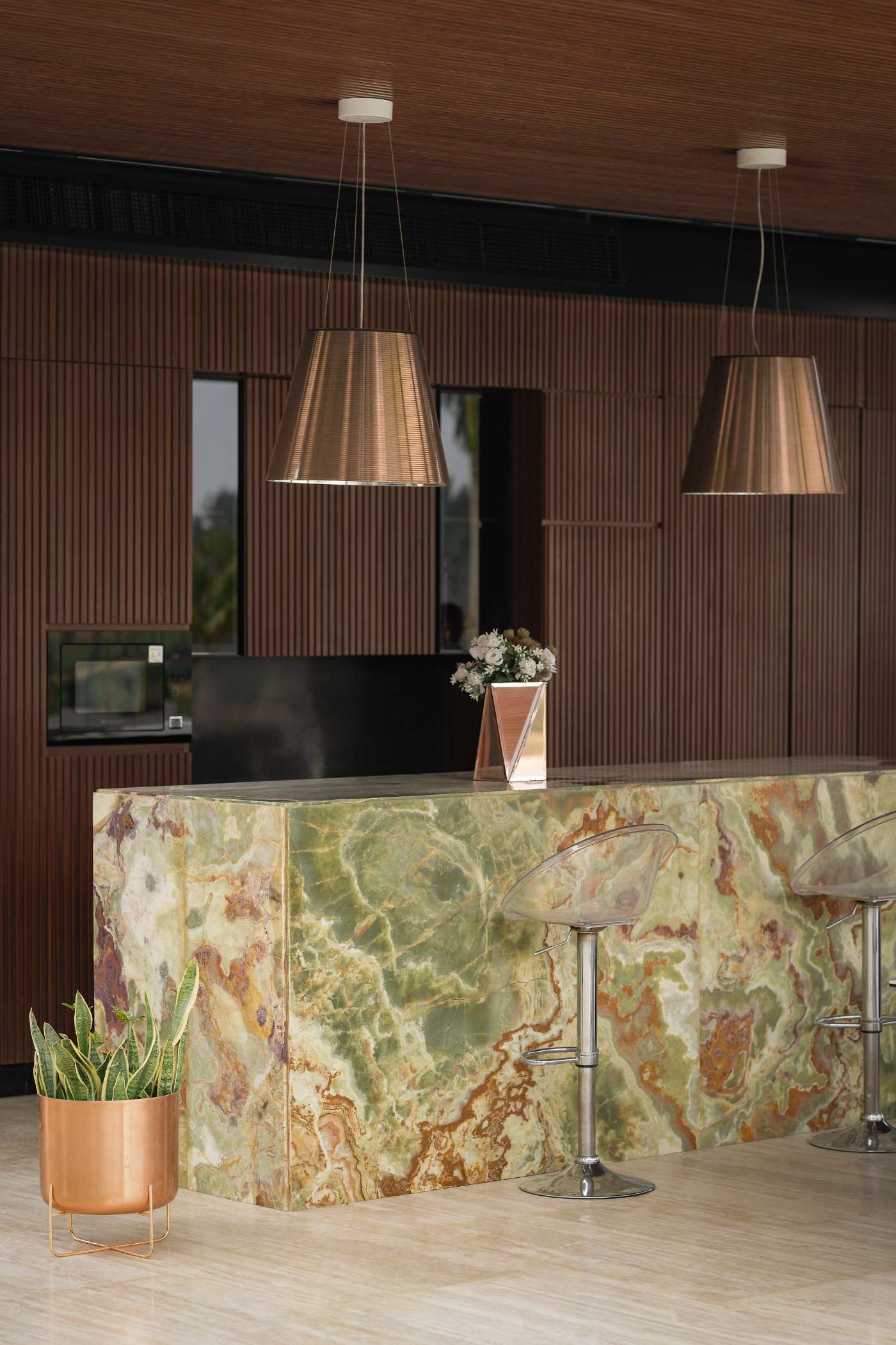 Green onyx bar with walnut panelling, Katameya Dunes Residence
