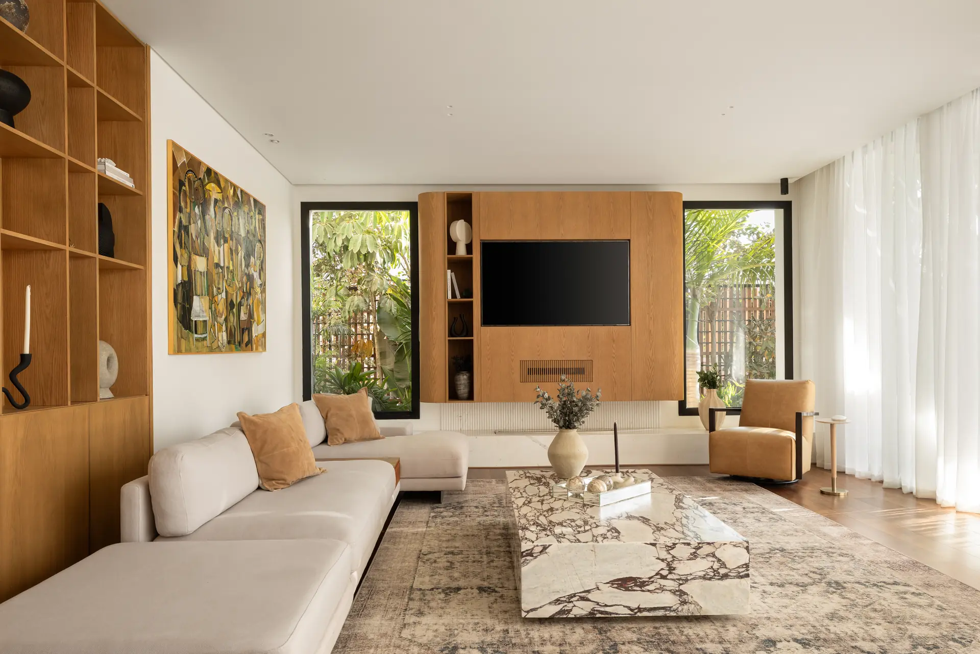 Living room with oak media unit and tall bookshelves, Allegria Villa