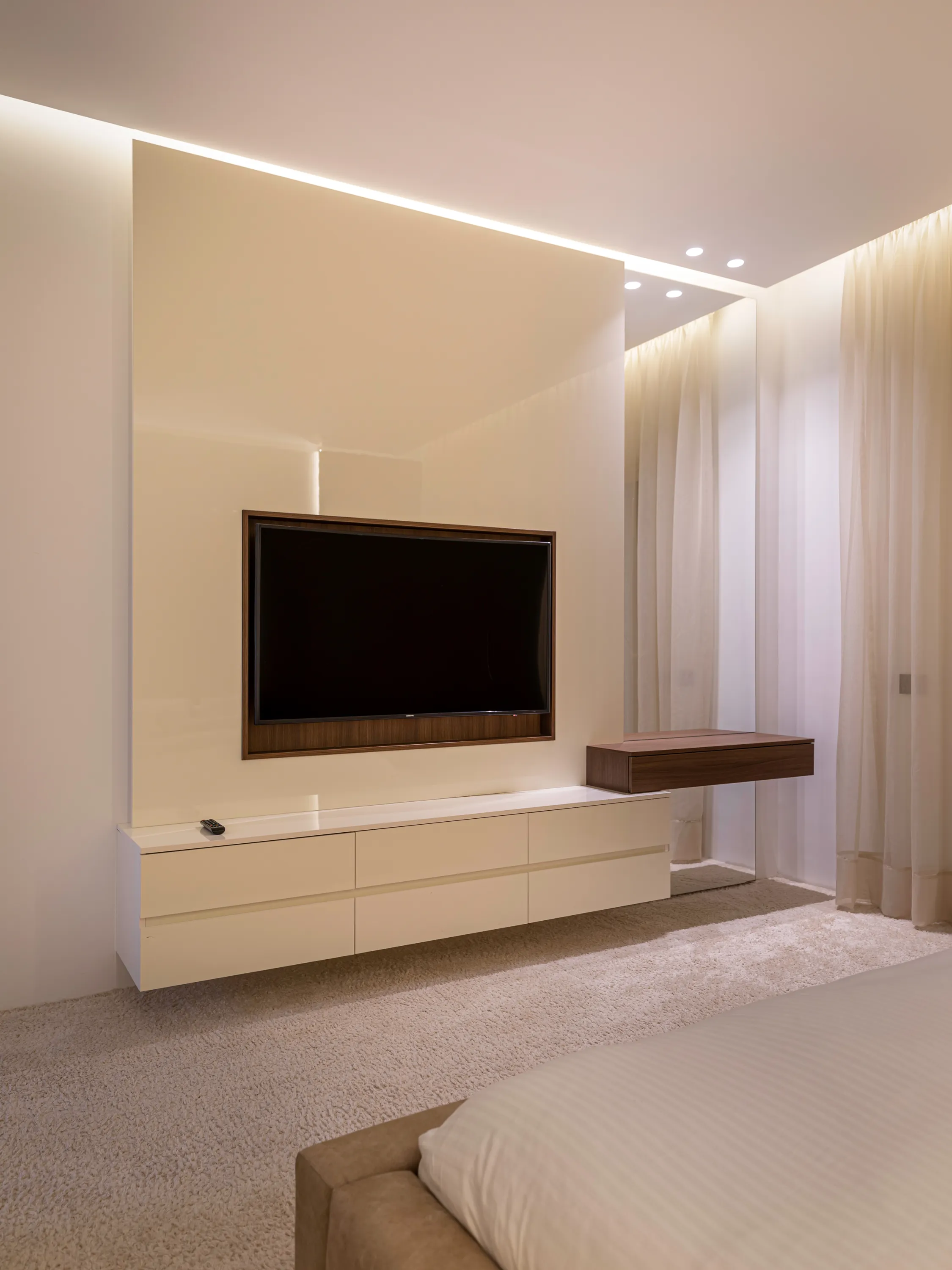 Floating white TV console in a bedroom, New Giza Villa