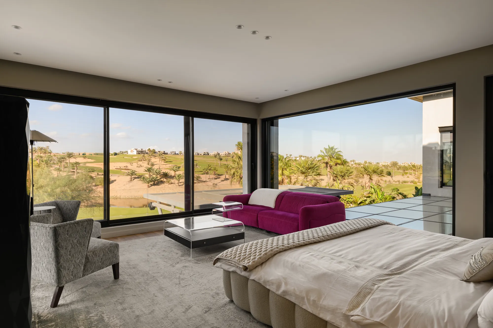 Master bedroom with upholstered bed facing the garden, Palm Hills Residence