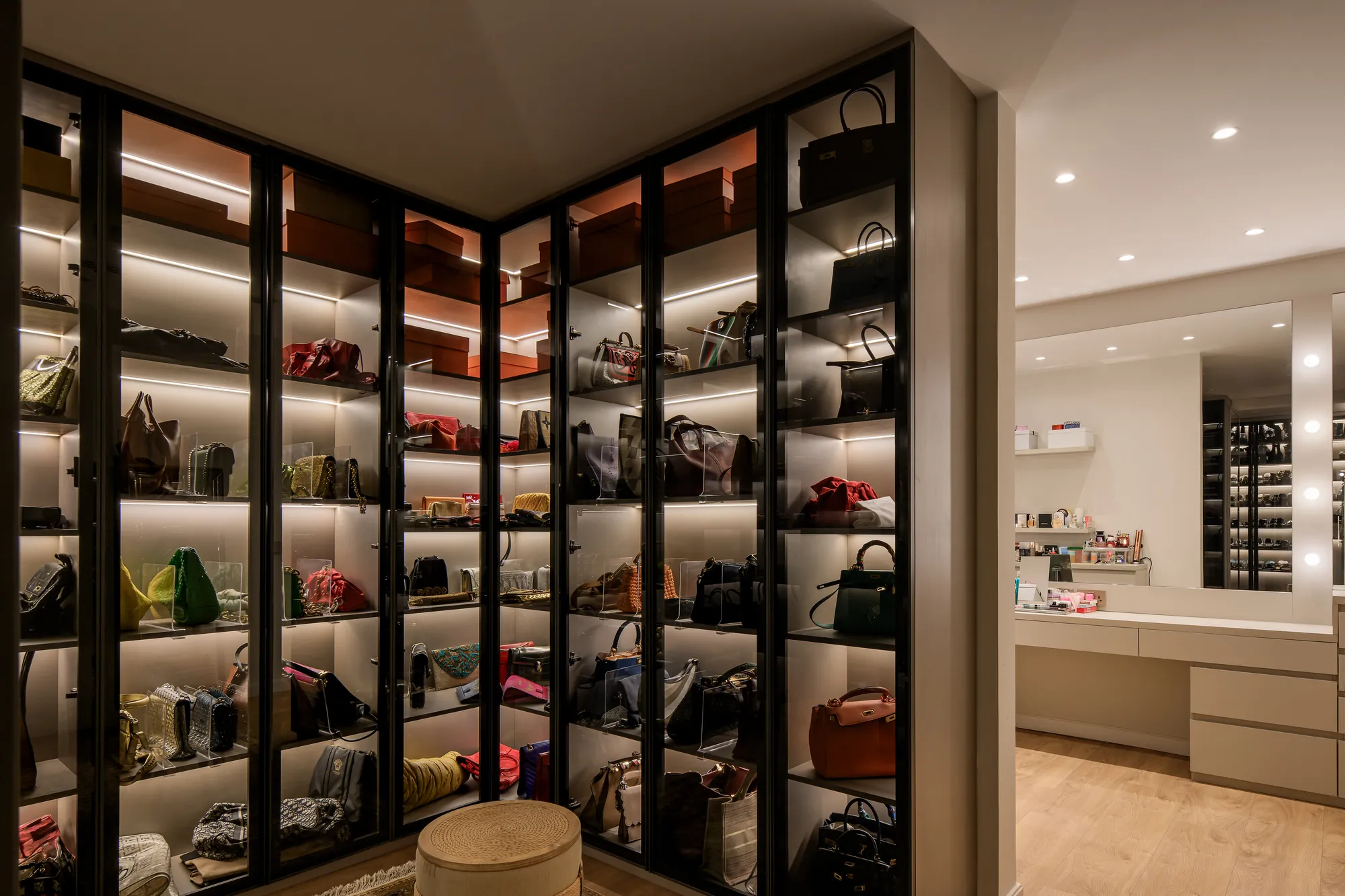 Dark framed glass wardrobes with integrated lighting, Palm Hills Residence