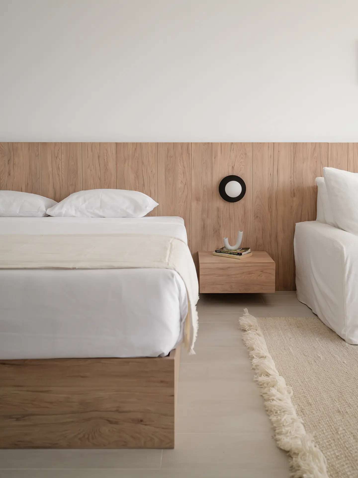 Light oak bed with floating bedside shelf, Somabay Lodge