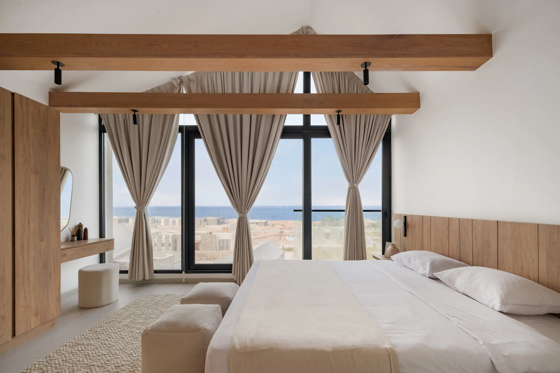Lodge bedroom with oak joinery and timber beams, Somabay